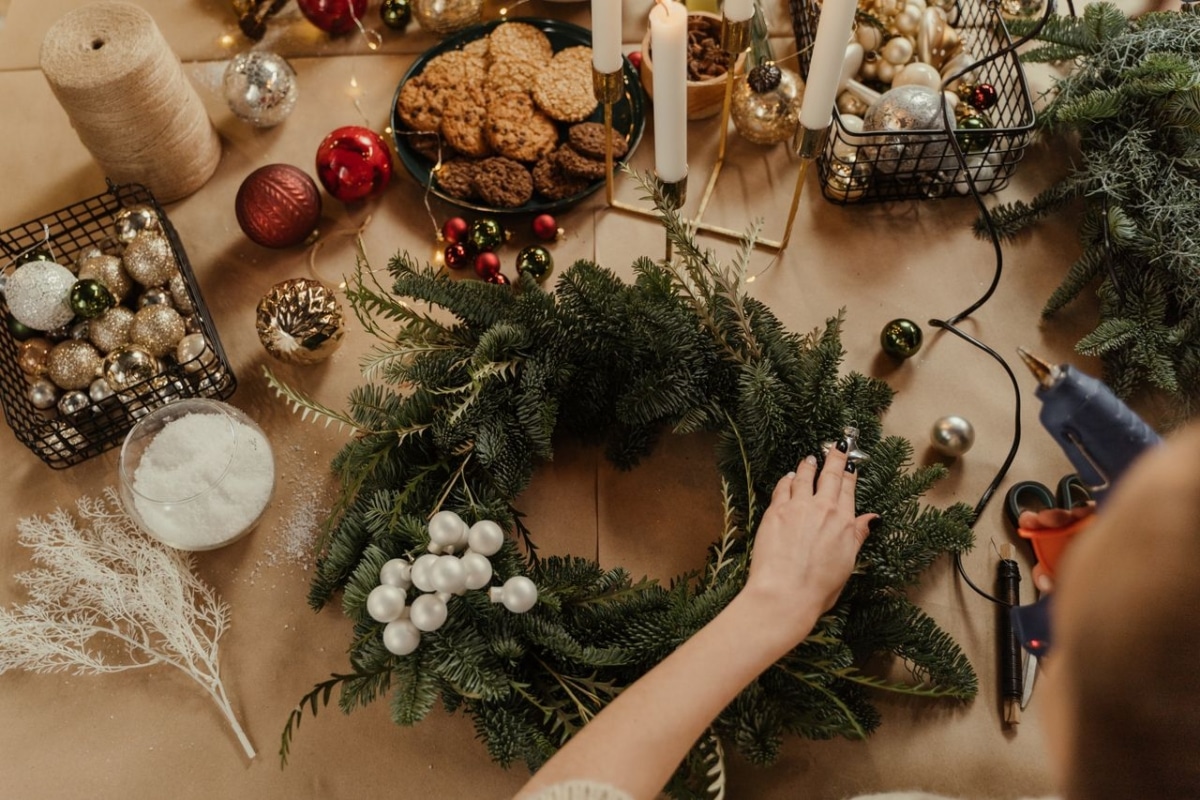 Create a festive Christmas wreath with ornaments and cookies for holiday decor.