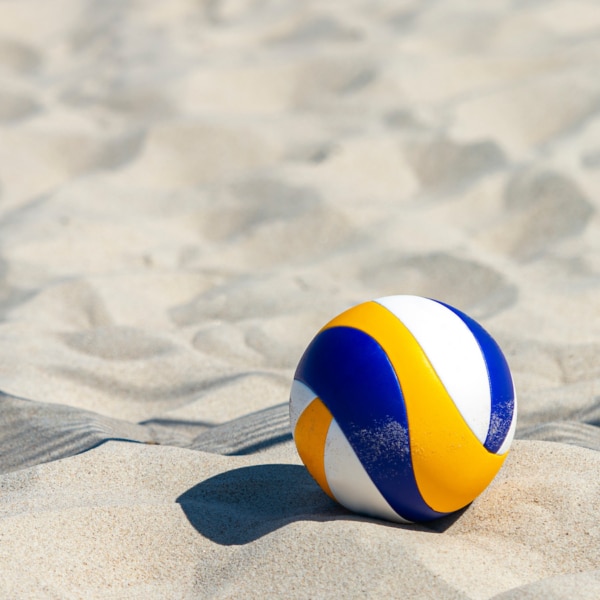 Beach volleyball ball on the sand beach. Team sport concept