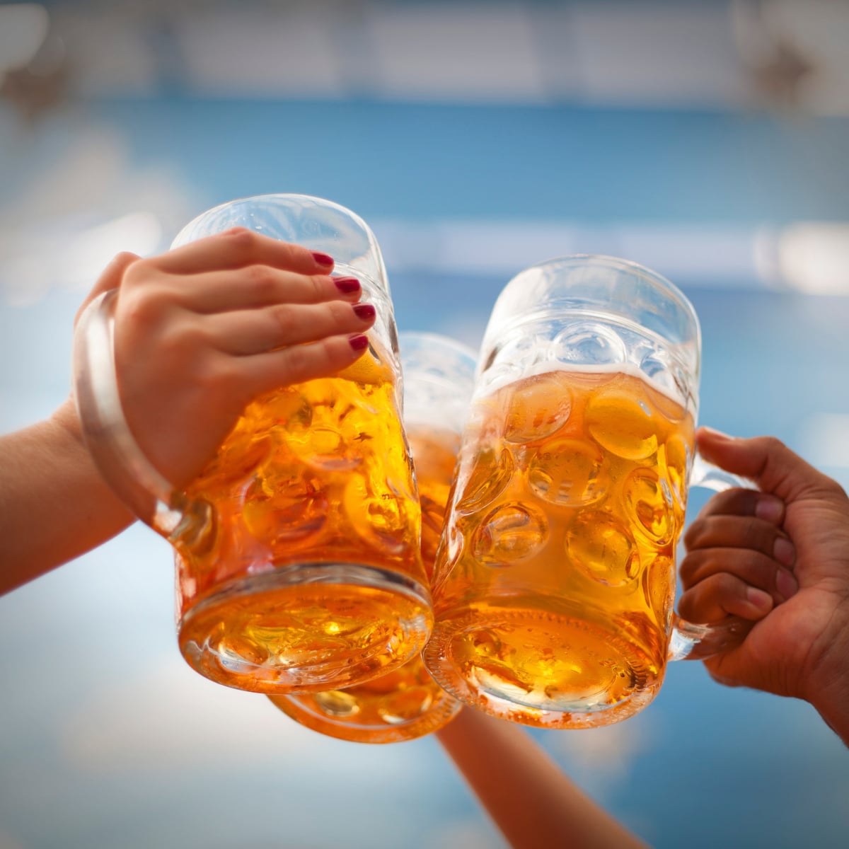 Raised beer mug toasting at Oktoberfest